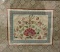 Vintage framed tapestry fabric art piece with floral pattern. Approx 20x18 inches.