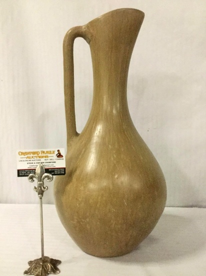 Tall smooth ceramic pitcher, unsigned, approx. 10x10x20.5 inches.