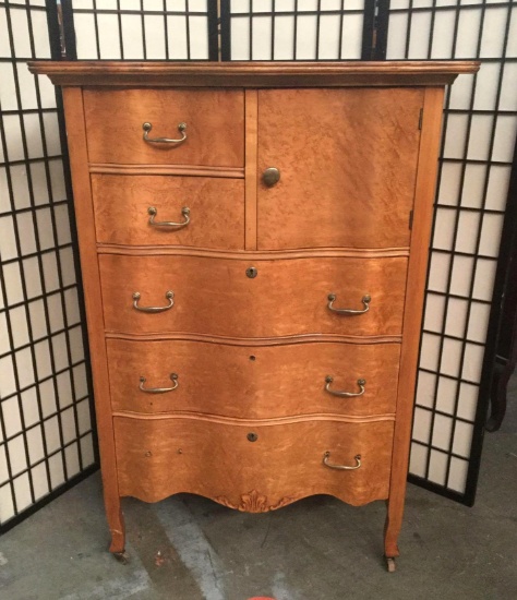 Vintage birds eye maple dresser with 5 shelves and a cabinet. Approx.35x20x50 inches.