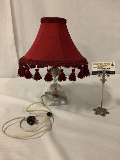 Vintage marble base floral patterned lamp with red tasseled shade. Tested/working approx 15x12x12 in