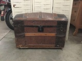 Vintage pressed leather travel trunk with removable interior shelf. Shows wear. Approx 32x23x18