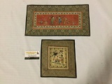 2 Asian tapestry cloth art pieces showing men & women in traditional attire. Approx 16.5x8.5 in.