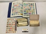 Large collection of hundreds of us and foreign stamps in a book and envelopes.