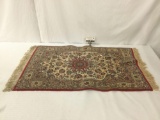 Small wool red/gray rug w/ floral patterns & fringe, approx. 44x24 inches.