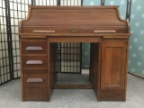 Antique late 1800s/early 1900s 5-drawer oak roll top desk w/casters, approx. 48x30x45 inches.