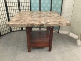 Tall stone top table with drawer. Approx 48x48x36 inches.