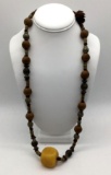 Vintage Asian metal, wood and resin bead necklace. Approx 18 inches.