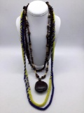 4 vintage foreign necklaces. Seeds, beads, African nut & pod necklace. Longest approx 40 inches.
