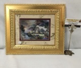 Framed Thomas Kinkade print of quaint cottage. Approx 14x12.5 inches.