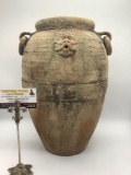 Antique Italian clay vase w/ring handles & face design, signed L. Cellar on bottom.