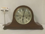 Vintage wood unmarked mantle clock w/Popular Progress #10 key, untested, approx. 5x15x5 inches.