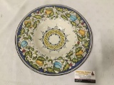 Painted wall plate with fruit design signed Diponto Amano. approx 13x13 inches.