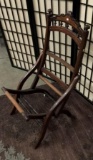 Antique wooden folding chair missing cushion. Approx 35x18x20 inches.