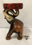 Hand carved/painted vintage wooden elephant stand. Measures approx 20x13x11 inches.