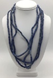 Collection of four strands of antique Czech blue glass African trade beads. Longest approx 24 inches