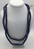 Two strands of antique blue glass trade beads. Longest approx 28 inches.