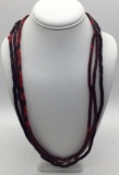 Collection of 3 strands of vintage bohemian red glass trade beads. Longest approx 28 inches.