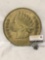 Metal plaque of 1859 Indian head penny.