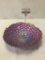 Purple art glass bowl with painted bottom.