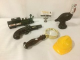 Five Avon aftershave bottles, incl. a turkey, a pistol, a train, magnifying glass & hardhat.