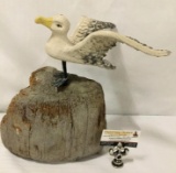 Ceramic and metal seagull garden statue on wooden log. Approx 14x14x12 inches.