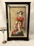 Japanese drum playing geisha doll in wood & glass display box, approx. 21.5x13x12 inches.