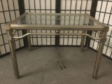 Vintage metal coffee table w/ glass top, approx. 20x29x30 inches.