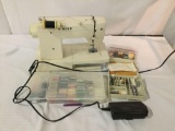 Singer 5525 electric sewing machine. Tested and working. Comes with spare parts and thread.