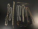 Collection of 11 estate jewelry necklaces.
