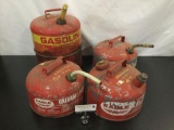 Collection of four vintage metal gas cans.