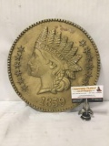 Metal plaque of 1859 Indian head penny.