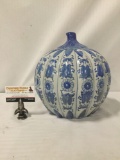 Vintage stoneware jar with floral pattern.