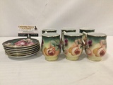 Set of 6 hand painted gold rimmed floral pattern china teacups and saucers.
