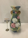 Hand painted stoneware vase with floral pattern. Signed by artist.