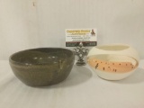 Two stoneware pottery bowls, one of which depicts an adobe building, both signed by artist Kat.