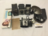 Collection of 4 vintage box cameras. Cine-Kodak, Spartus, Falcon and more. Untested.
