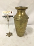 Vintage bronze urn with dents. Measures approx 10x5.5x5.5 inches.