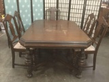 Vintage dark wood dining table, w/five floral upholstered vintage chairs, Approx. 44x60x29 inche