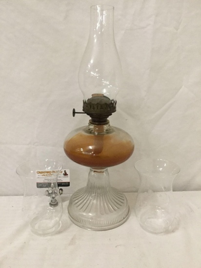Antique glass oil lamp with pressed glass base - with kerosene. Approx. 20 inches.