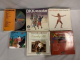 73 Laserdiscs, almost entirely karaoke, with a couple of work out discs. Country, Rock, Gospel and