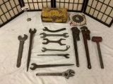 12 large hand tools w/ toolbox, saw blades, monkey wrenches, misc wrenches and more.