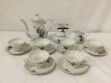 Unmarked tea set,... teapot approx 9x9x5 inches
