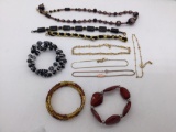 Estate jewelry: black bracelets, glass bead necklace, 4 ankle bracelets and more