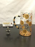 Hand painted glass pitcher, signed by artist. Approx 8x6 inches.