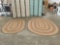 Pair of thick braided wool circular area rugs with muted color pallet
