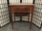 Vintage maple sewing cabinet with no machine and worn top - as is