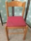 Wood chair w/ red upholstered seat, shows wear, approx 33x18x17 inches.