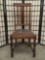 Antique late 1800's oak dining chair with original worn seat, and barley twist carved design