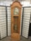 Howard Miller Tempos Fugit grandfather clock in fine oak case .