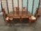 Vintage stow-leaf dining table w/ 4 chairs. Table w/ leaves retracted approx 56x38x29 inches.